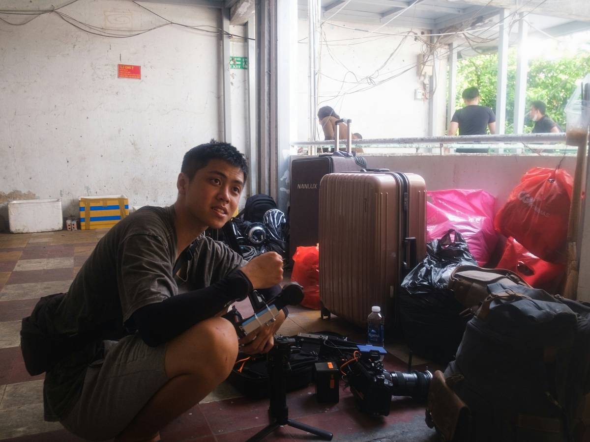 Compact portable teleprompter for travel mounted on smartphone during outdoor filming